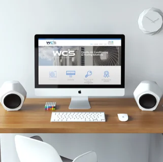WCS website designed by Dastardly Design, shown on an iMac